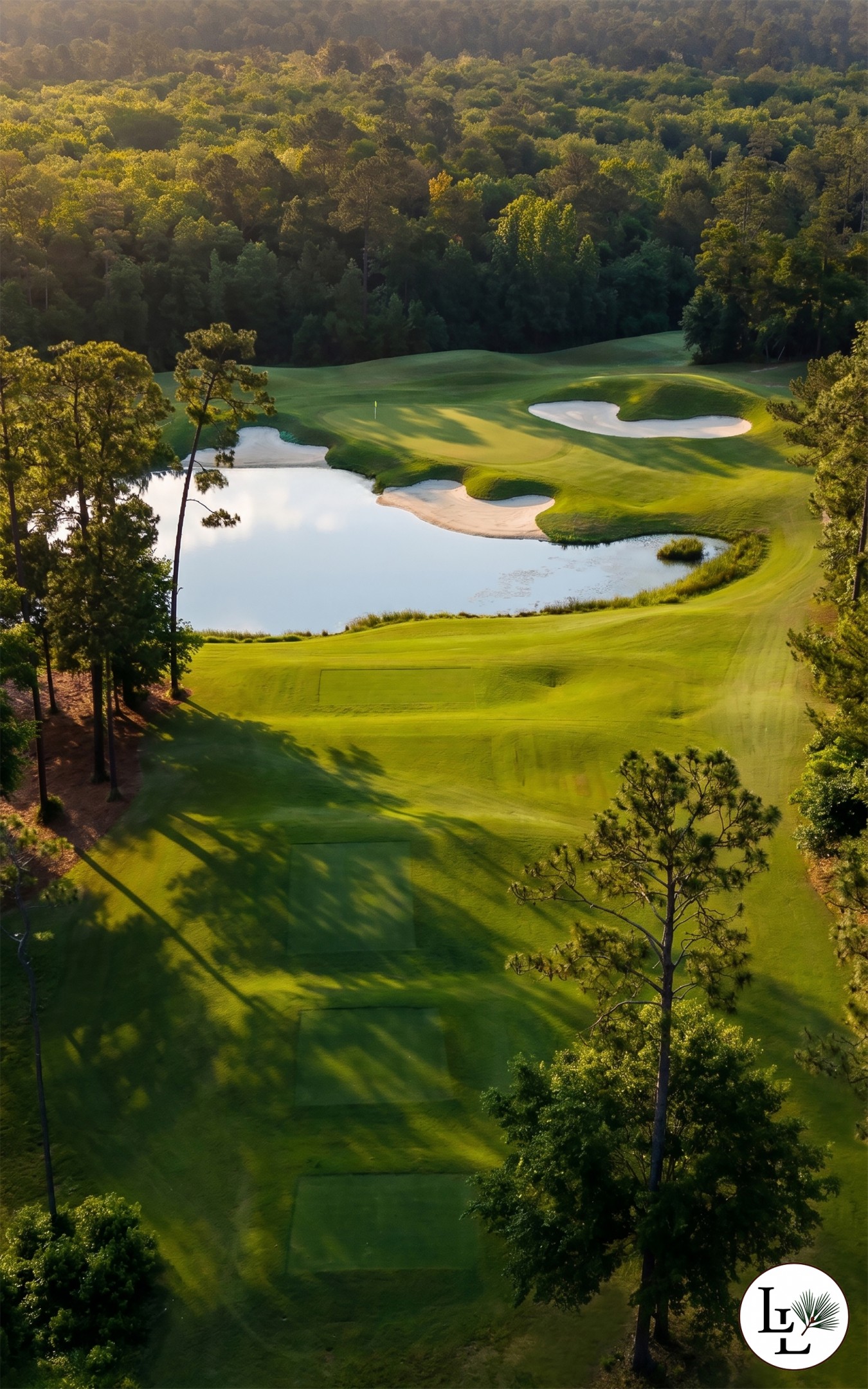 A green set against open water at Longleaf